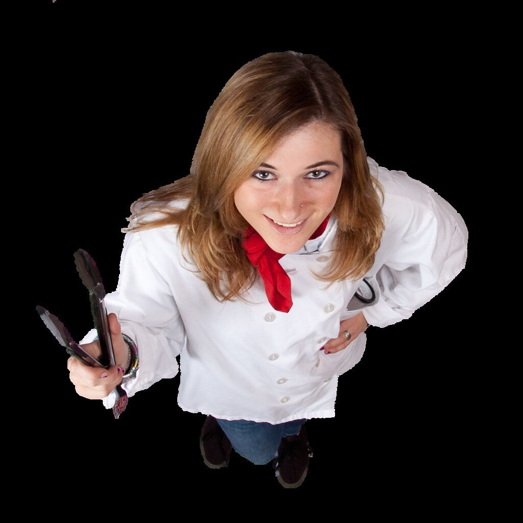 Overhead view of female chef holding tongs